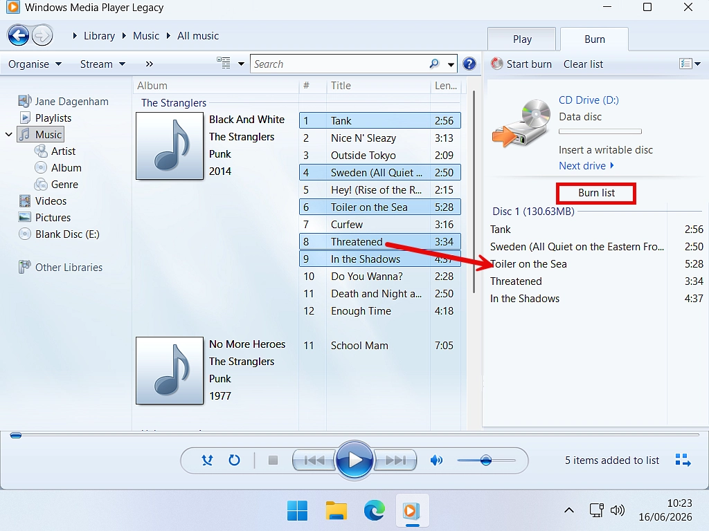 Create burn list Audio tracks being dragged and dropped onto the Burn List in Windows Media Player legacy.