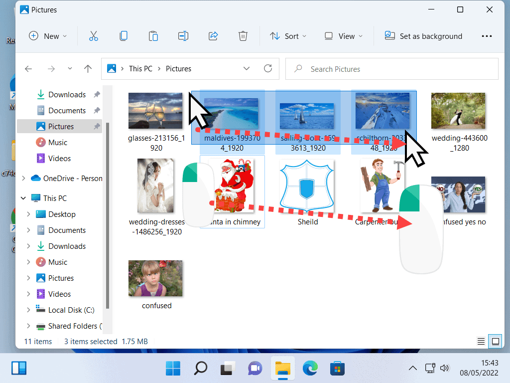 Mouse pointer being dragged across files to be selected.