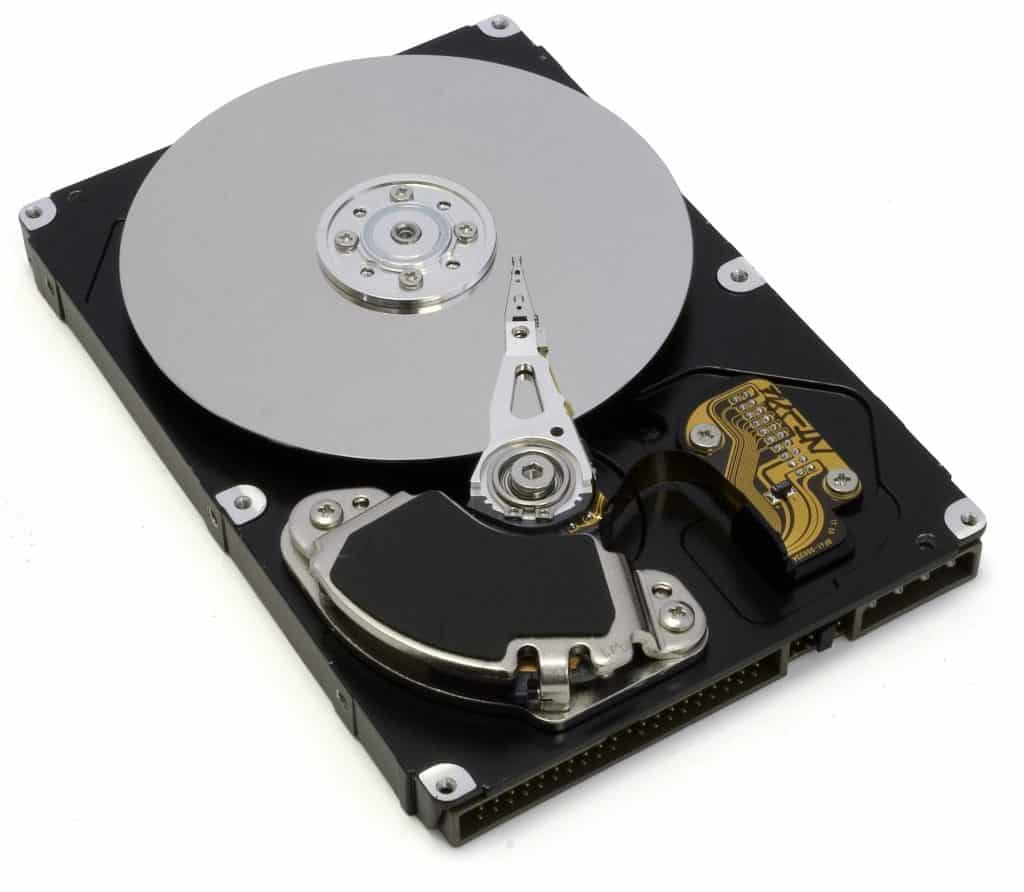 A computer hard drive with the top removed to reveal the inside.