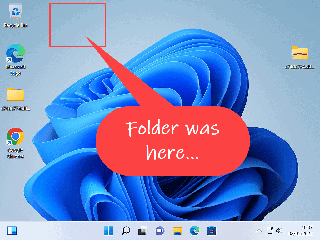 Windows 11 desktop. Where the folder was located is now empty space. Text reads "Folder was here".