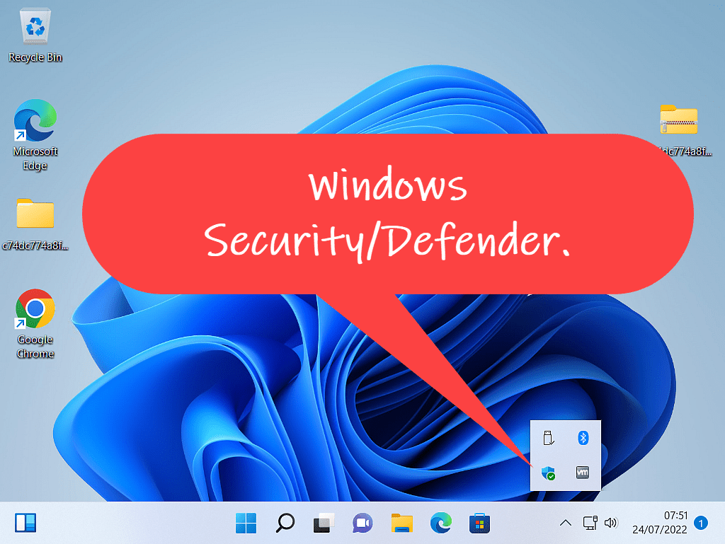 Callout indicating the Windows Security icon in the hidden icons area.