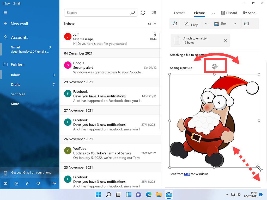 Picture of Santa Claus has been inserted into an email. The image resize and rotate handles are marked.