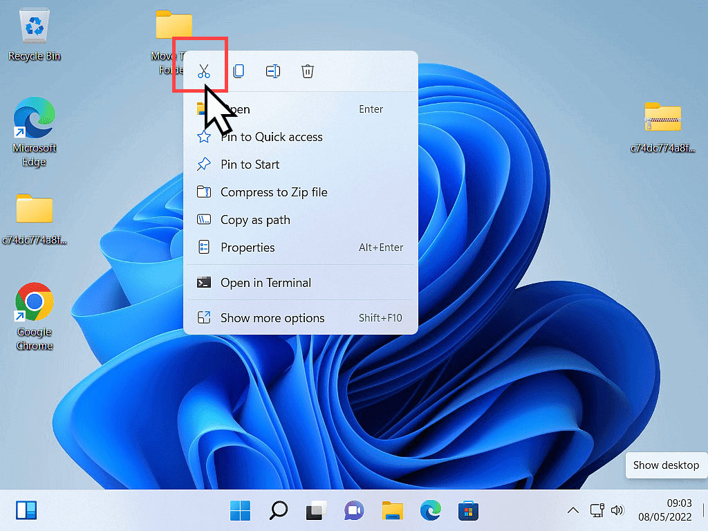 In Windows 11, the options menu is open and the Cut icon (scissors) is marked.