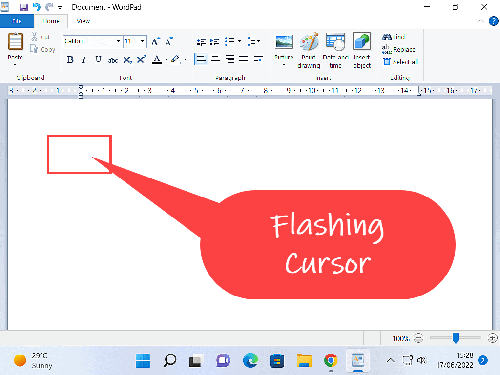 Wordpad is open to a blank document. The flashing (blinking) cursor is indicated.