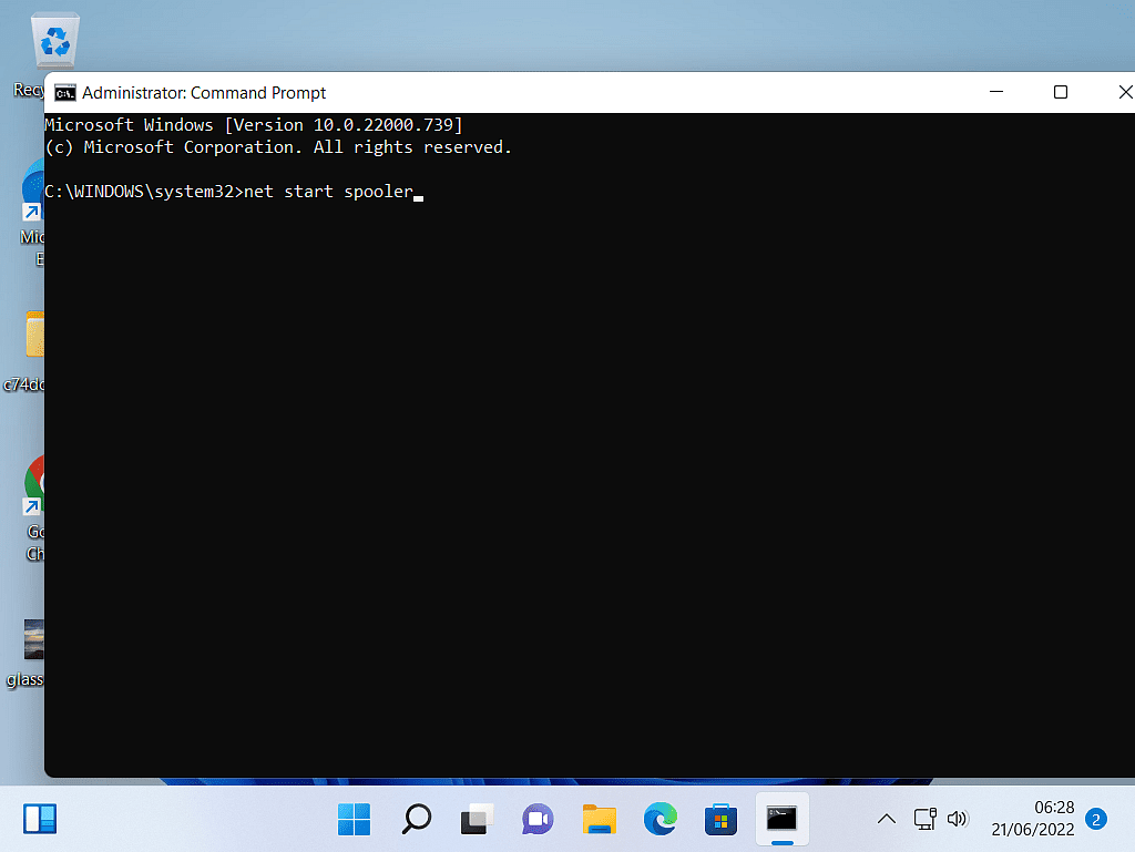 Command Prompt window. "Net start spooler" has been typed in.