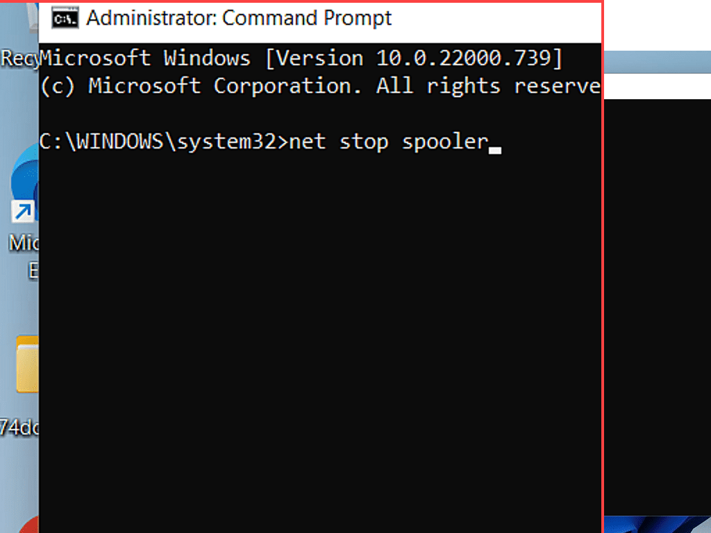 Close up view of the Command Prompt window. Net stop spooler can be seen clearly.