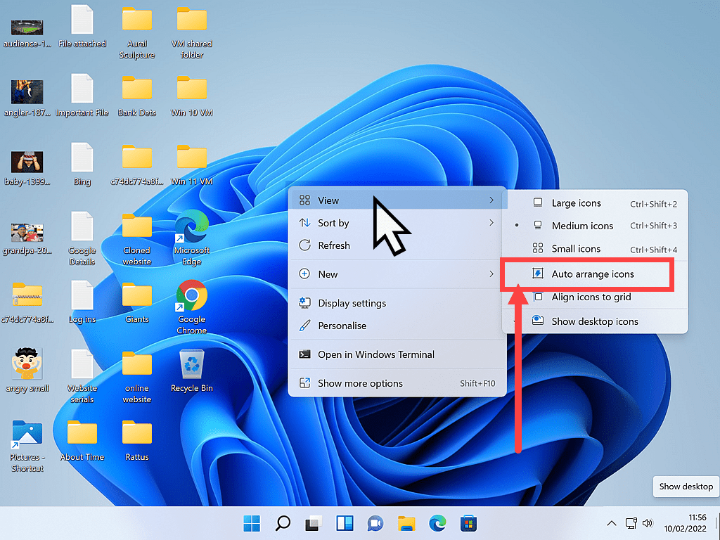 Deselecting Auto arrange icons from Desktop options menu in Windows 11.