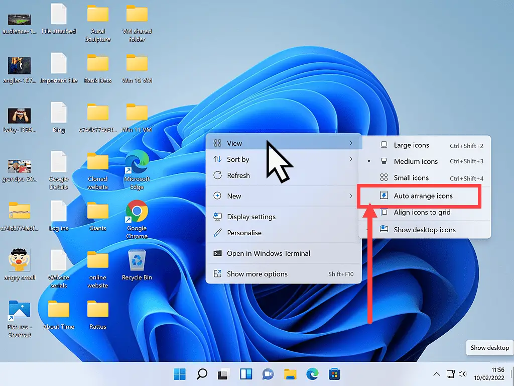 Deselecting Auto arrange icons from Desktop options menu in Windows 11.