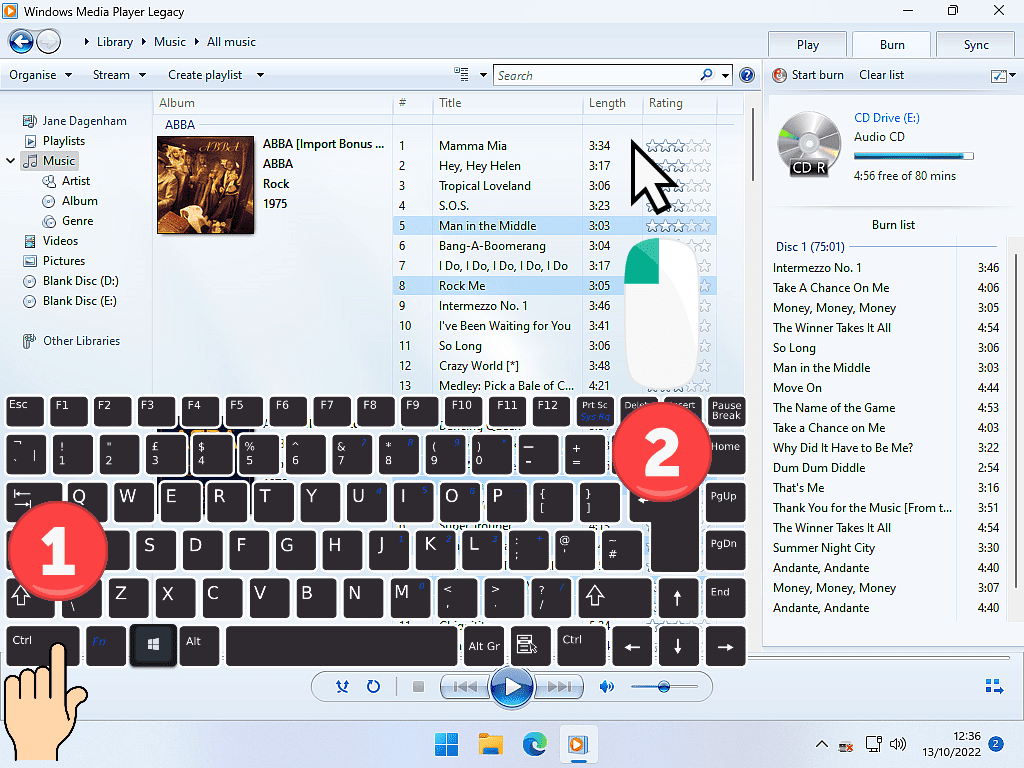 Adding multiple tracks to the Burn List in Windows Media Player.