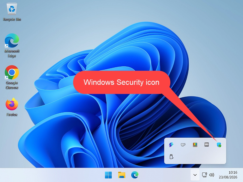 A callout indicating the Windows Security icon in the hidden icons area of the taskbar in Windows 11.