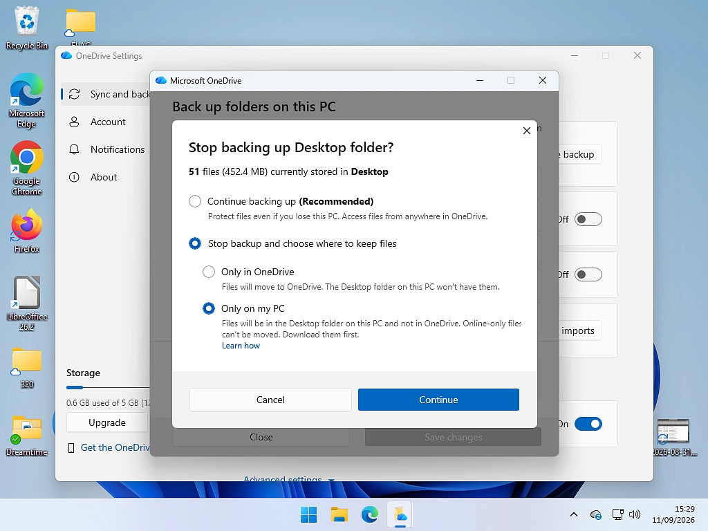 The OneDrive prompt asking whether to keep files on this PC or remove them, when stopping a folder backup.