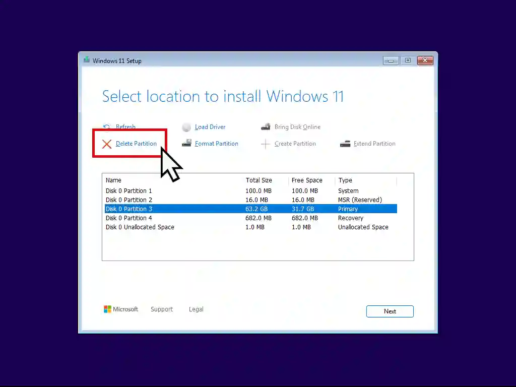 Windows 11 setup screen. Partitions are being deleted.