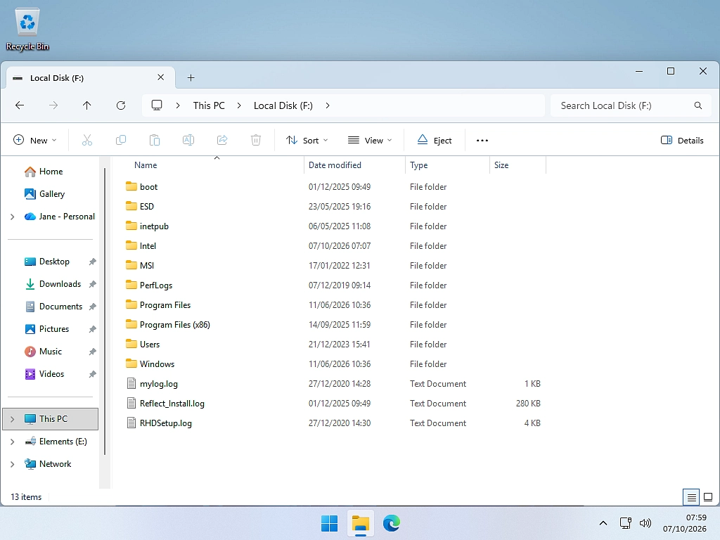 A VHDX copy of an old PC opened as a drive in This PC on a new computer.