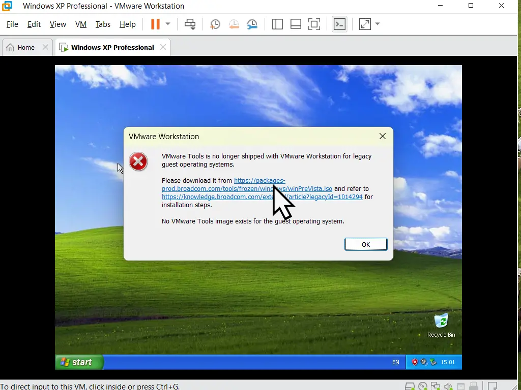 Windows XP virtual machine. Popup message reads "VMware Tools is no longer shipped with VMware Workstation for legacy guest operating systems".